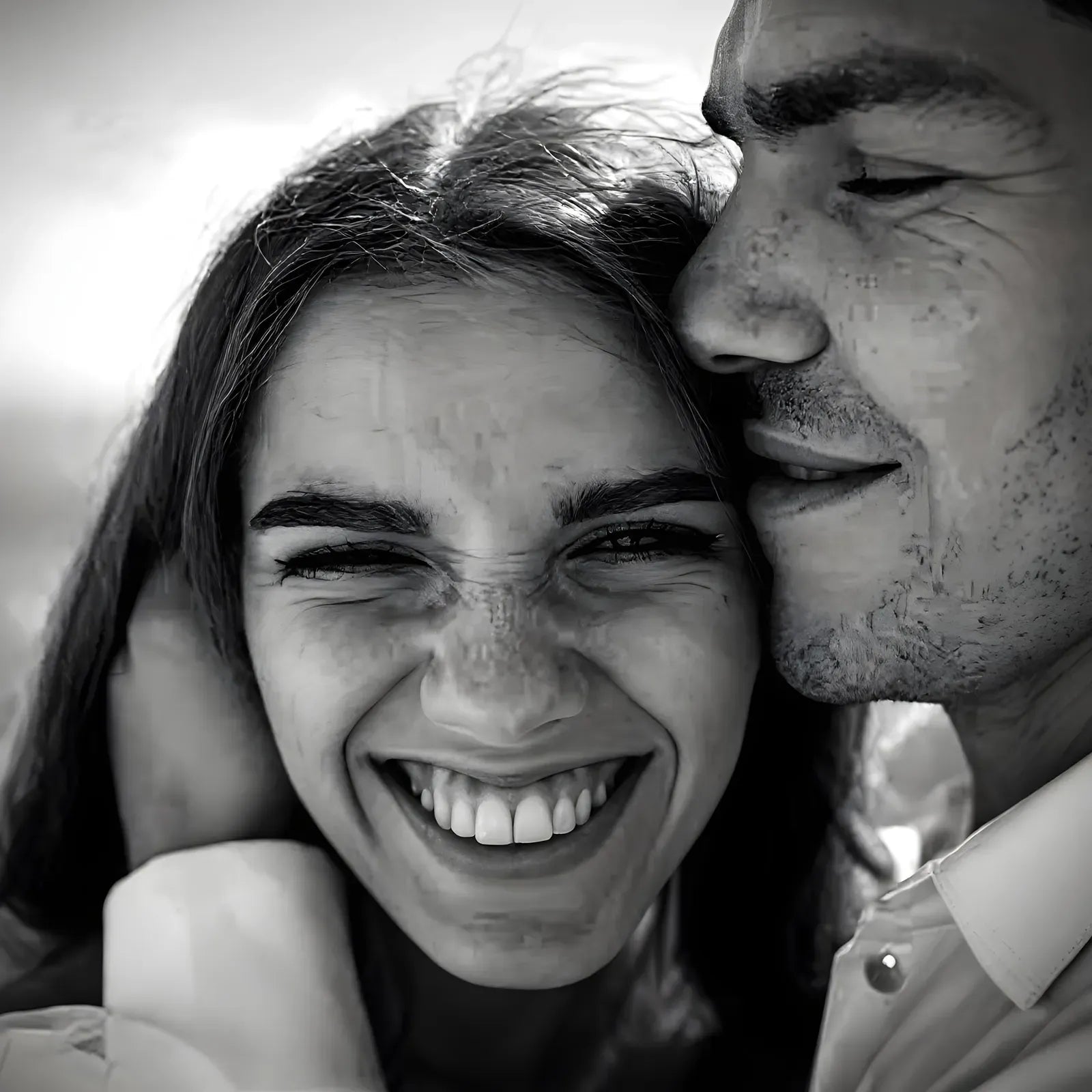 A laughing couple in fine-art monochrome